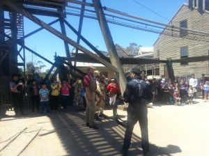 Workers explaining to diver, and visitors, the problem with the hose